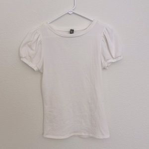 A white puff sleeve blouse by Francesca’s Boutique